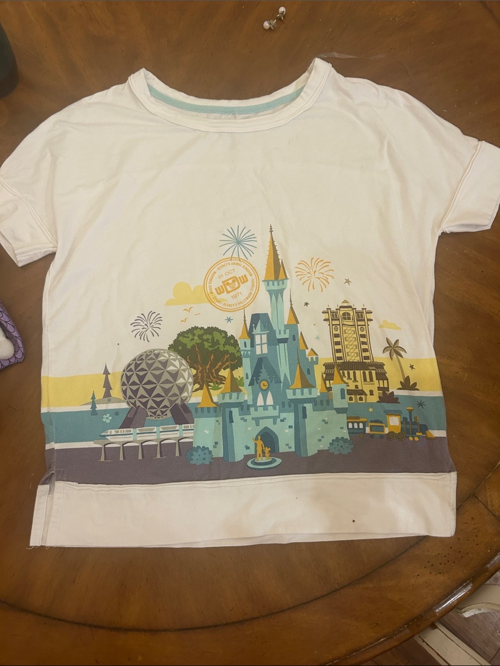 Disney ParksWhite Short Sleeve Tee with Blue and Yellow Castle Graphic